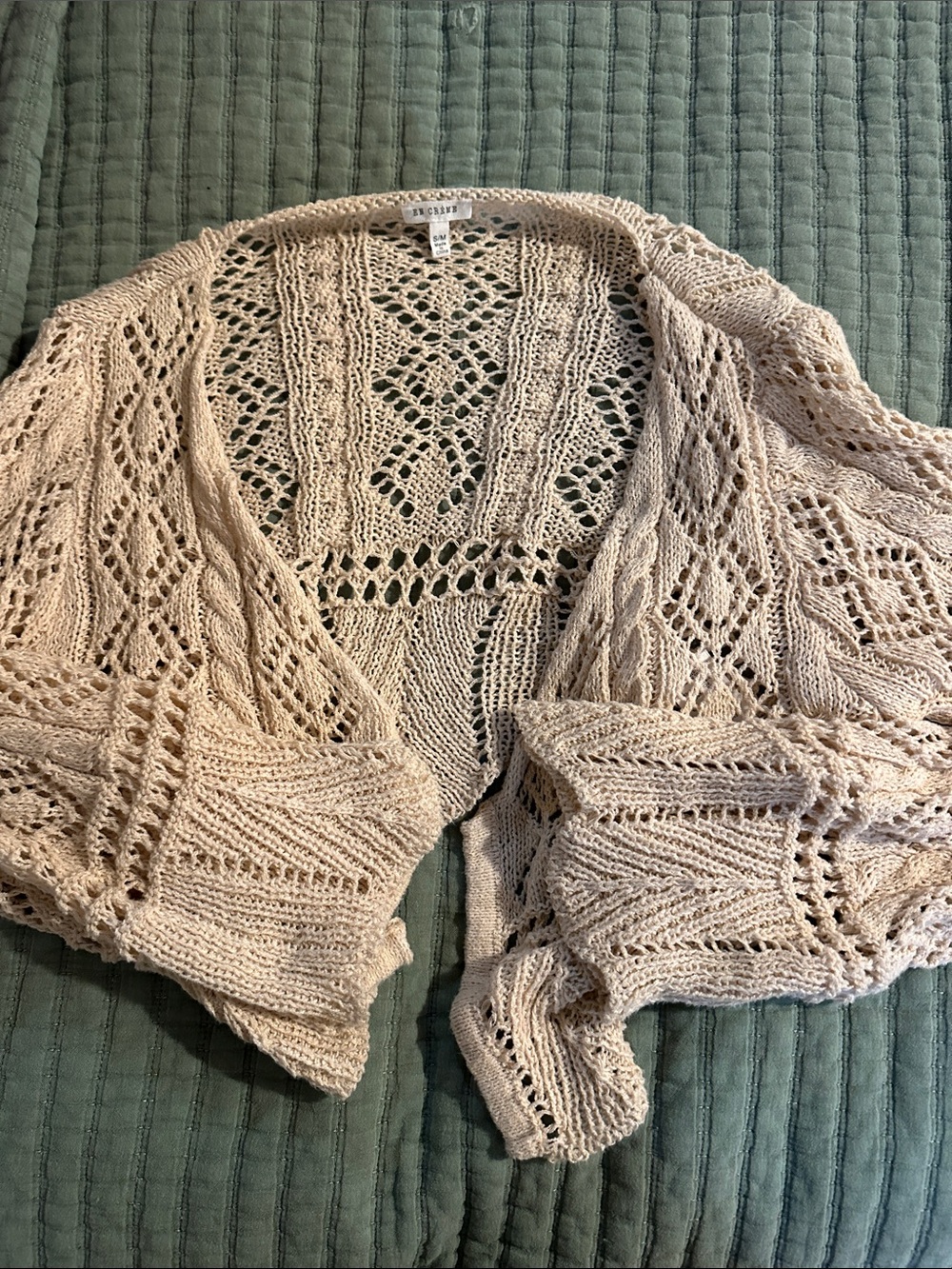 En creme open cardigan